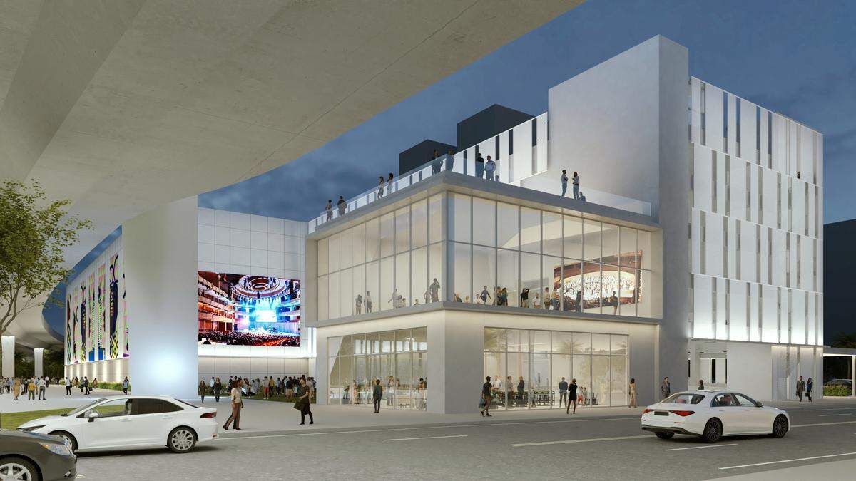 A rendering depicts a possible look for a proposed parking garage for the Arsht Center for the Performing Arts abutting a completed new westbound Interstate 395 span, at left. The 750-space garage would also include two studios, at center, a plaza behind those, and Art in Public Places works.